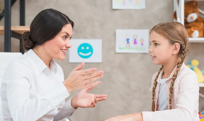smiling portrait girl female psychologist having conversation office 1
