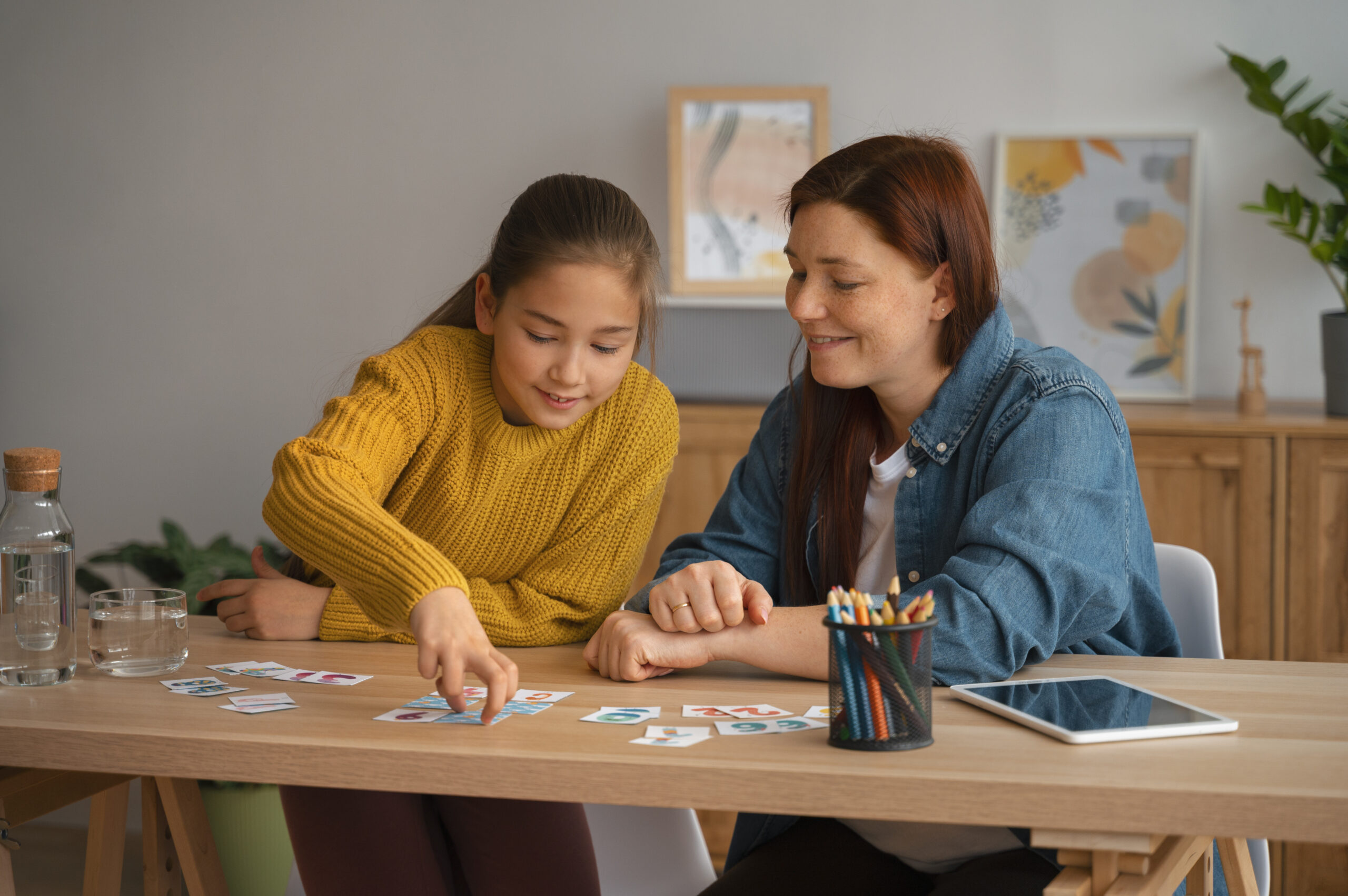 medium shot woman girl playing memory game 2 scaled