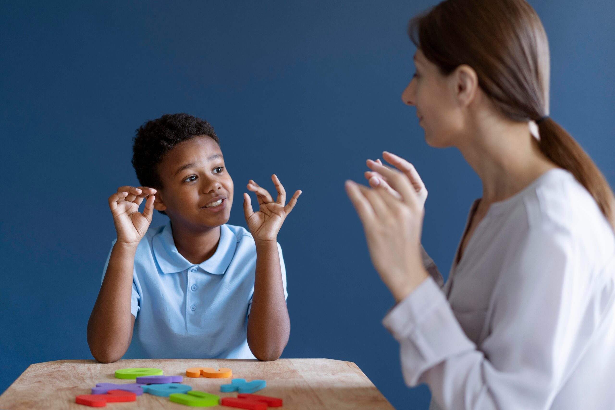 boy having occupational therapy session with psychologist 1 scaled