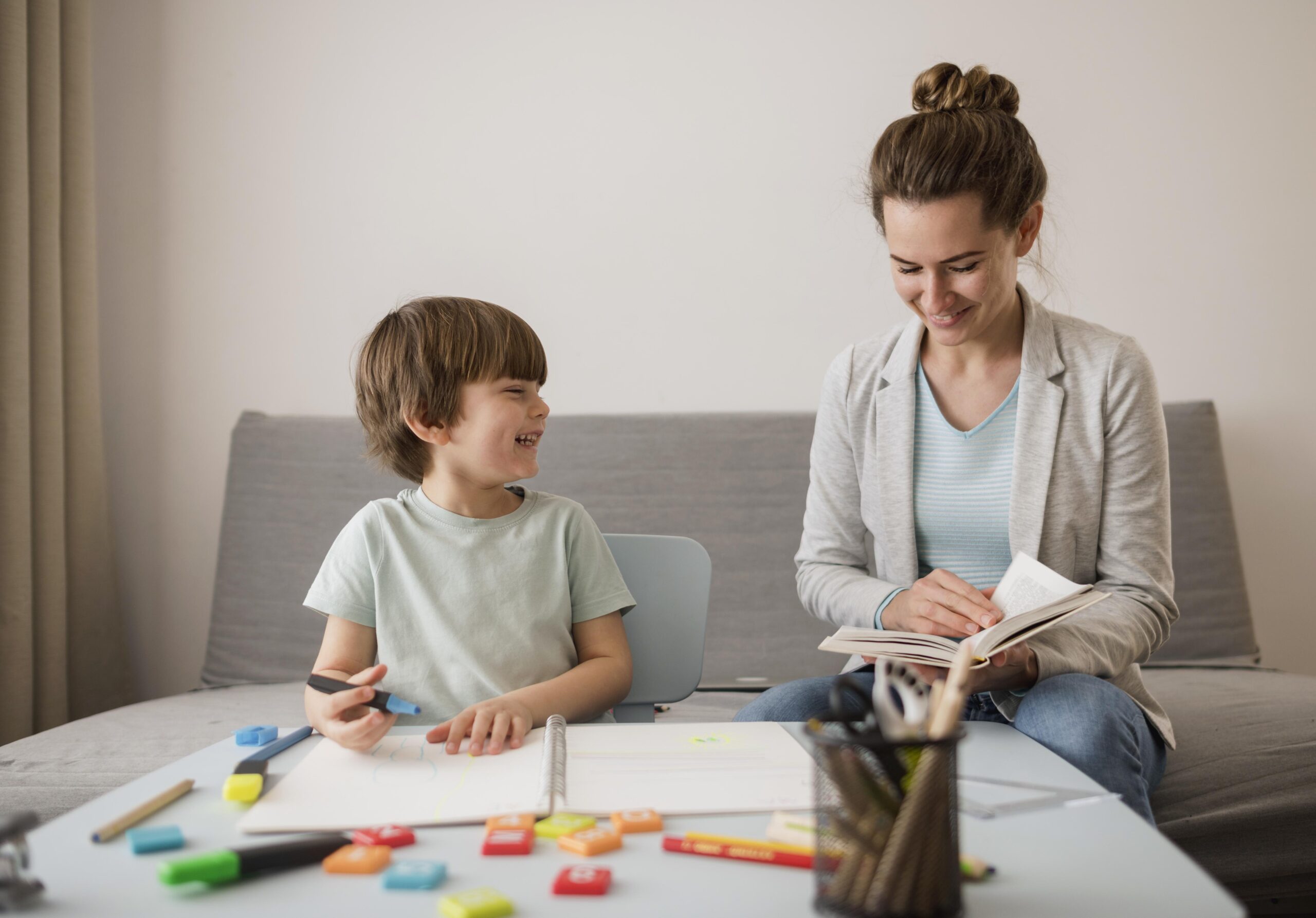 front view child being tutored home by woman 2 scaled